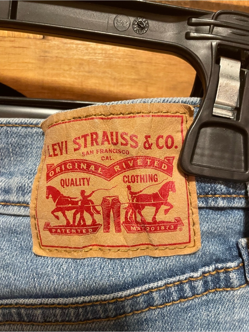 Levi's Women's Straight Leg Jeans — Light Blue Denim with Tan Leather Patch